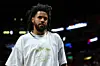 J Cole is seen in attendance during Game Three of the 2023 NBA Finals between the Denver Nuggets and the Miami Heat at Kaseya Center on June 07, 2023 in Miami, Florida.