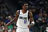Kyrie Irving #11 of the Dallas Mavericks looks on during the first half of the game against the Charlotte Hornets at American Airlines Center on February 27, 2025 in Dallas, Texas.
