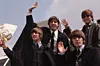 The Beatles, John Lennon, George Harrison (1943 - 2001), Paul McCartney and Ringo Starr, pictured on their arrival in London following a tour of Australia.