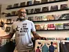 Home Rule Records owner Charvis Campbell in front of records