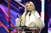 Doja Cat accepts an iHeartRadio Titanium Award for 'Woman' onstage during the 2023 iHeartRadio Music Awards at Dolby Theatre on March 27, 2023 in Hollywood, California.