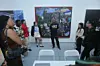 Gallerist Richard Beavers speaks to students with the Fashion For All Foundation at the Richard Beavers Gallery at SCOPE Art Fair as part of Art Basel Miami Beach on December 9, 2023 in Miami, Florida.