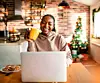 Young woman using a laptop during christmas