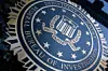 A seal reading 'Department of Justice Federal Bureau of Investigation' is displayed on the J. Edgar Hoover FBI building in Washington, DC, o August 9, 2022.