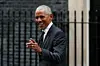 Former US President Barack Obama reacts as he leaves 10 Downing Street in central London, on March 18, 2024, following a meeting with Britain's Prime Minister Rishi Sunak.