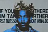Kendrick lamar wearing a crown.