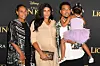 US rapper Chance The Rapper, wife Kirsten Corley (C) and daughter Kensli Bennett arrive for the world premiere of Disney's 'The Lion King' at the Dolby theatre on July 9, 2019 in Hollywood.