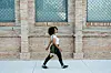 A young woman walking in the city.