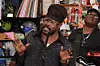 Beenie Man sings into a microphone on NPR's classic Tiny Desk set.