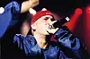 Eminem With a mic in hand in a close up photo from 2000.