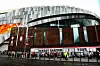 Beyonce fans, also known as the 'BeyHive', queue in the rain for entry at Tottenham Hotspur Stadium ahead of her second performance on June 7, 2025 in London, England.